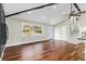 Open concept living area with hardwood floors, modern fireplace, high ceilings, and natural light at 2178 Shamrock Dr, Decatur, GA 30032