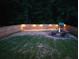 A fenced backyard with a cozy fire pit area and play structure is perfect for Gathering time at 2573 Paul Nw Ave, Atlanta, GA 30318