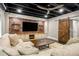 Finished basement featuring a large sectional sofa, TV, and rustic sliding barn door at 2573 Paul Nw Ave, Atlanta, GA 30318
