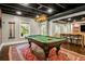 Finished basement with a pool table and bar area with stools, perfect for entertaining at 2573 Paul Nw Ave, Atlanta, GA 30318