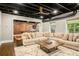 Finished basement with a large sectional sofa and a game room with a pool table at 2573 Paul Nw Ave, Atlanta, GA 30318