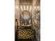 Unique bathroom with black marble walls, a unique round mirror and an elegant, decorative sink at 2573 Paul Nw Ave, Atlanta, GA 30318