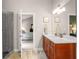Bright bathroom with white counter top, dark wood cabinets, glass shower and view to the bedroom at 2573 Paul Nw Ave, Atlanta, GA 30318