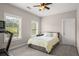 Bedroom featuring large windows for natural light, ceiling fan, and treadmill at 2573 Paul Nw Ave, Atlanta, GA 30318