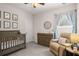 Comfortable Bedroom with gray furniture set, light blue curtains and decorative animal artwork at 2573 Paul Nw Ave, Atlanta, GA 30318