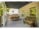 Outdoor deck with dining table, seating, and backyard view at 2573 Paul Nw Ave, Atlanta, GA 30318