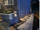 Well-lit exterior stone work and gravel path alongside the house at 2573 Paul Nw Ave, Atlanta, GA 30318