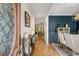 Inviting foyer with hardwood floors, decorative front door, and views into dining area at 2573 Paul Nw Ave, Atlanta, GA 30318