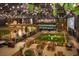 Indoor entertainment space with synthetic turf, games, picnic tables, string lights and lush greenery at 2573 Paul Nw Ave, Atlanta, GA 30318