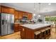 Spacious kitchen with stainless steel appliances, quartz countertops, wooden cabinets and a large island at 2573 Paul Nw Ave, Atlanta, GA 30318