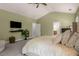 Spacious main bedroom with carpet floors, neutral walls, a flat-screen tv, and an ensuite bathroom at 2573 Paul Nw Ave, Atlanta, GA 30318