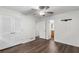 Bedroom includes hardwood floors, closet with louvered doors, ceiling fan, and access to an en-suite bathroom at 2644 Hickory Valley Dr, Snellville, GA 30078