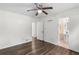 Bedroom featuring ceiling fan, hardwood floors, ensuite bathroom and closet space at 2644 Hickory Valley Dr, Snellville, GA 30078
