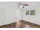 Primary bedroom features a ceiling fan, wood floors and an ensuite bathroom at 2644 Hickory Valley Dr, Snellville, GA 30078