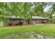 A well-maintained brick home with a spacious backyard and mature trees at 2644 Hickory Valley Dr, Snellville, GA 30078