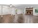 Spacious living room featuring hardwood floors, a brick fireplace and abundant natural light at 2644 Hickory Valley Dr, Snellville, GA 30078