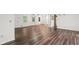 Bright, spacious living room with hardwood floors, white walls, and natural lighting at 2644 Hickory Valley Dr, Snellville, GA 30078