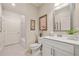 Well-lit bathroom with modern fixtures, vanity with storage, and tiled floors at 84 Cedarcrest Village Ln, Acworth, GA 30101