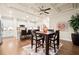 Dining area with coffered ceilings, hardwood floors, modern lighting, and stainless steel appliances in view at 84 Cedarcrest Village Ln, Acworth, GA 30101