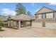 Charming home featuring a neutral color, well-maintained lawn, a two-car garage, and a cozy front porch at 84 Cedarcrest Village Ln, Acworth, GA 30101