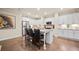 Open kitchen with white cabinets, granite countertops, stainless steel appliances, and a central island at 84 Cedarcrest Village Ln, Acworth, GA 30101