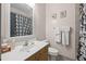 Bathroom featuring a vanity, toilet, shower, and decorative shower curtain at 1308 Fernwood Ne Cir, Atlanta, GA 30319
