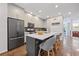 This kitchen features a stylish island with seating, stainless steel appliances, and modern cabinetry for a sleek cooking space at 1308 Fernwood Ne Cir, Atlanta, GA 30319