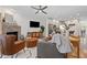 Inviting open-concept living room featuring a brick fireplace, modern furnishings, and seamless flow to the kitchen at 1308 Fernwood Ne Cir, Atlanta, GA 30319