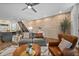 Spacious living room featuring an exposed brick wall, modern staircase and open layout to the kitchen at 1308 Fernwood Ne Cir, Atlanta, GA 30319