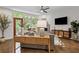 Open living room featuring hardwood floors, a modern console table, natural light, and access to the outdoor patio at 1308 Fernwood Ne Cir, Atlanta, GA 30319