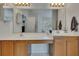 Bright bathroom features dual sinks, large mirror, vanity and natural light from the window at 1942 Westover Nw Ln, Kennesaw, GA 30152