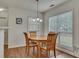 Cozy breakfast nook with a wood table set and a pendant light fixture at 1942 Westover Nw Ln, Kennesaw, GA 30152
