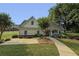 Community clubhouse exterior featuring manicured landscaping, shrubs, and a welcoming entrance at 1942 Westover Nw Ln, Kennesaw, GA 30152
