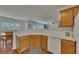 Bright kitchen features wooden cabinets, white countertops, and modern appliances overlooking the dining area at 1942 Westover Nw Ln, Kennesaw, GA 30152