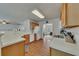 Well-lit kitchen featuring wood floors, cabinets, and sleek appliances at 1942 Westover Nw Ln, Kennesaw, GA 30152