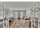 Inviting living room with French doors and a view of the home's entry way at 1942 Westover Nw Ln, Kennesaw, GA 30152