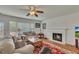 Bright living room with a fireplace, ceiling fan, and a comfortable sofa at 1942 Westover Nw Ln, Kennesaw, GA 30152