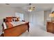 Bright main bedroom features a vaulted ceiling, fan, and soft carpet at 1942 Westover Nw Ln, Kennesaw, GA 30152