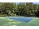 Community tennis courts surrounded by mature trees, perfect for active residents at 1942 Westover Nw Ln, Kennesaw, GA 30152