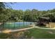 A view of the community tennis courts, surrounded by trees, complete with an observation deck at 1942 Westover Nw Ln, Kennesaw, GA 30152