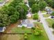 Aerial view of a home with lush landscaping, a well-manicured lawn, and a surrounding neighborhood at 2881 Bridle Creek Sw Dr, Conyers, GA 30094