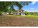 Expansive backyard with lush greenery, mature trees, and a well-maintained lawn at 2881 Bridle Creek Sw Dr, Conyers, GA 30094