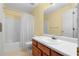 Well-lit bathroom featuring a white sink vanity and a shower-tub combination at 2881 Bridle Creek Sw Dr, Conyers, GA 30094