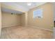 Spacious bedroom with large window and ceiling fan providing natural light and air circulation at 2881 Bridle Creek Sw Dr, Conyers, GA 30094