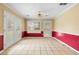 A sunny dining area with tile flooring and large windows offering plenty of natural light at 2881 Bridle Creek Sw Dr, Conyers, GA 30094