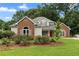 Charming single-Gathering home with brick accents, well-maintained landscaping, and a welcoming front porch at 2881 Bridle Creek Sw Dr, Conyers, GA 30094