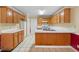 Functional kitchen with ample cabinet storage, white countertops, and an adjacent dining area, perfect for Gathering meals at 2881 Bridle Creek Sw Dr, Conyers, GA 30094