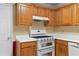 Well-lit kitchen featuring ample counter space, modern appliances, and plenty of storage in the wooden cabinetry at 2881 Bridle Creek Sw Dr, Conyers, GA 30094