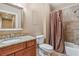 This bathroom has a tile floor and shower, granite counters, stainless steel fixtures, and neutral paint at 4541 Gateway Se Ct, Smyrna, GA 30080