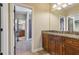 Bathroom with dual vanities, granite countertops, and wood cabinets offers ample space and storage at 4541 Gateway Se Ct, Smyrna, GA 30080